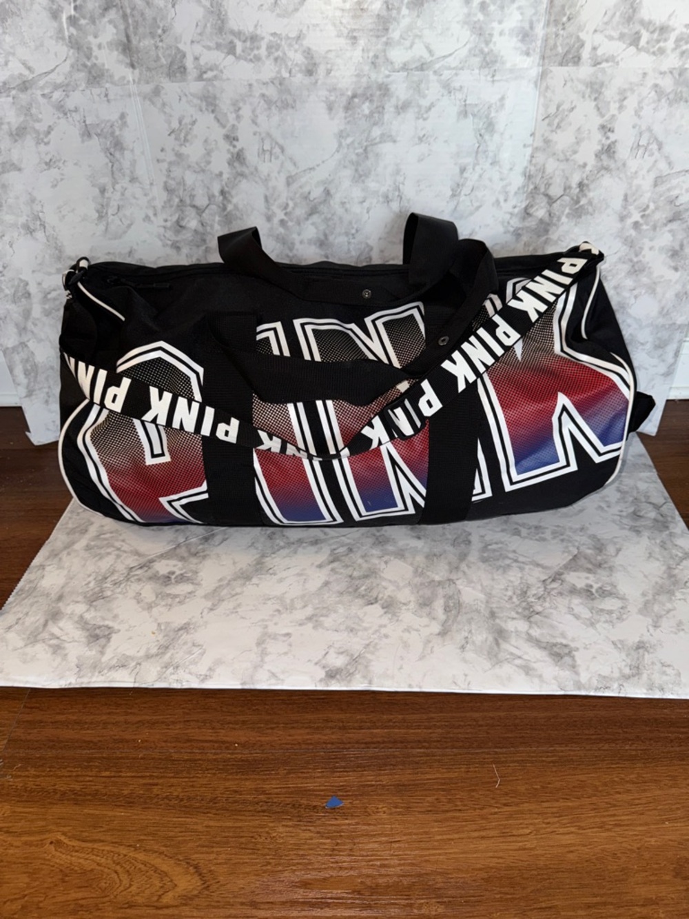 PINK Victoria's Secret Black Duffel with Red-to-Blue Gradient Logo